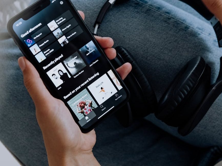 person using spotify on an iphone